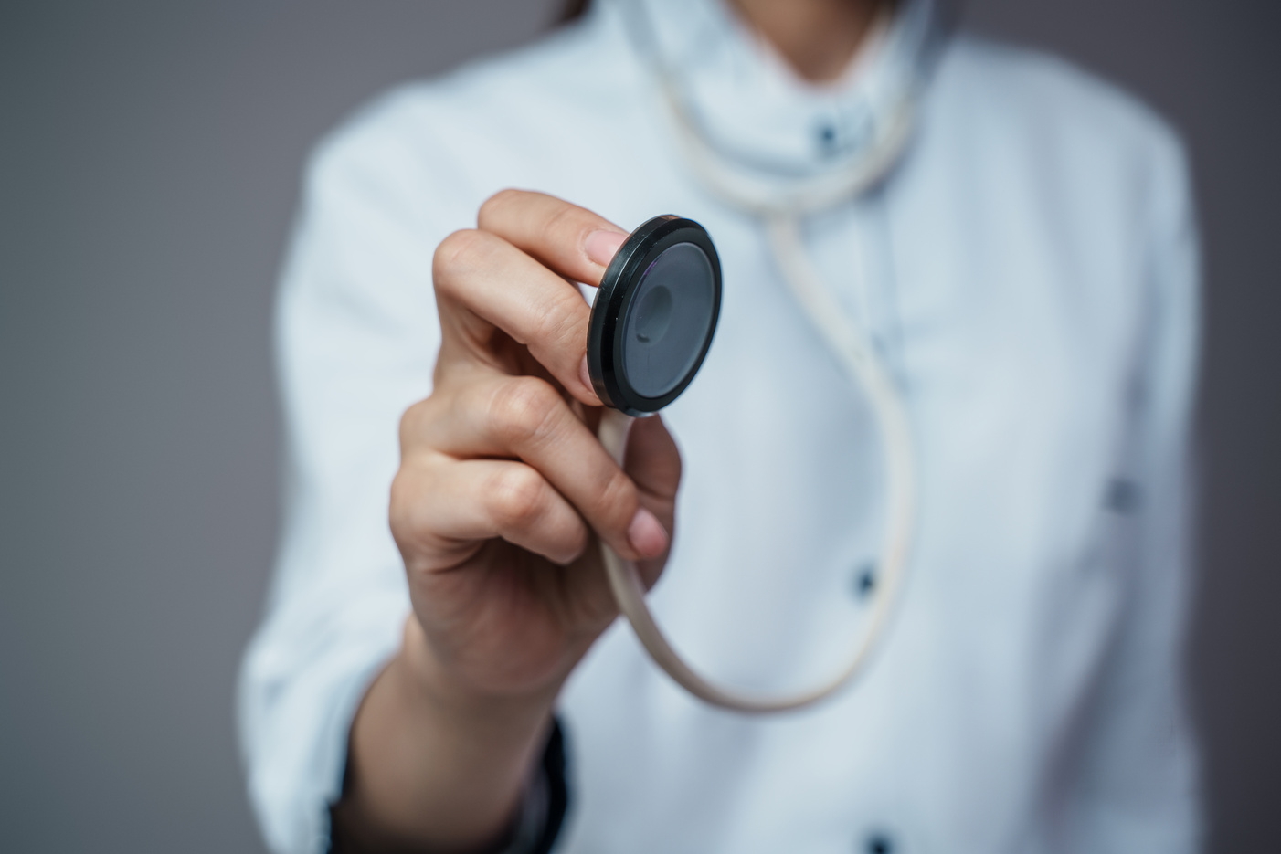Woman Doctor with Stethescope Dressed in White Labcoat