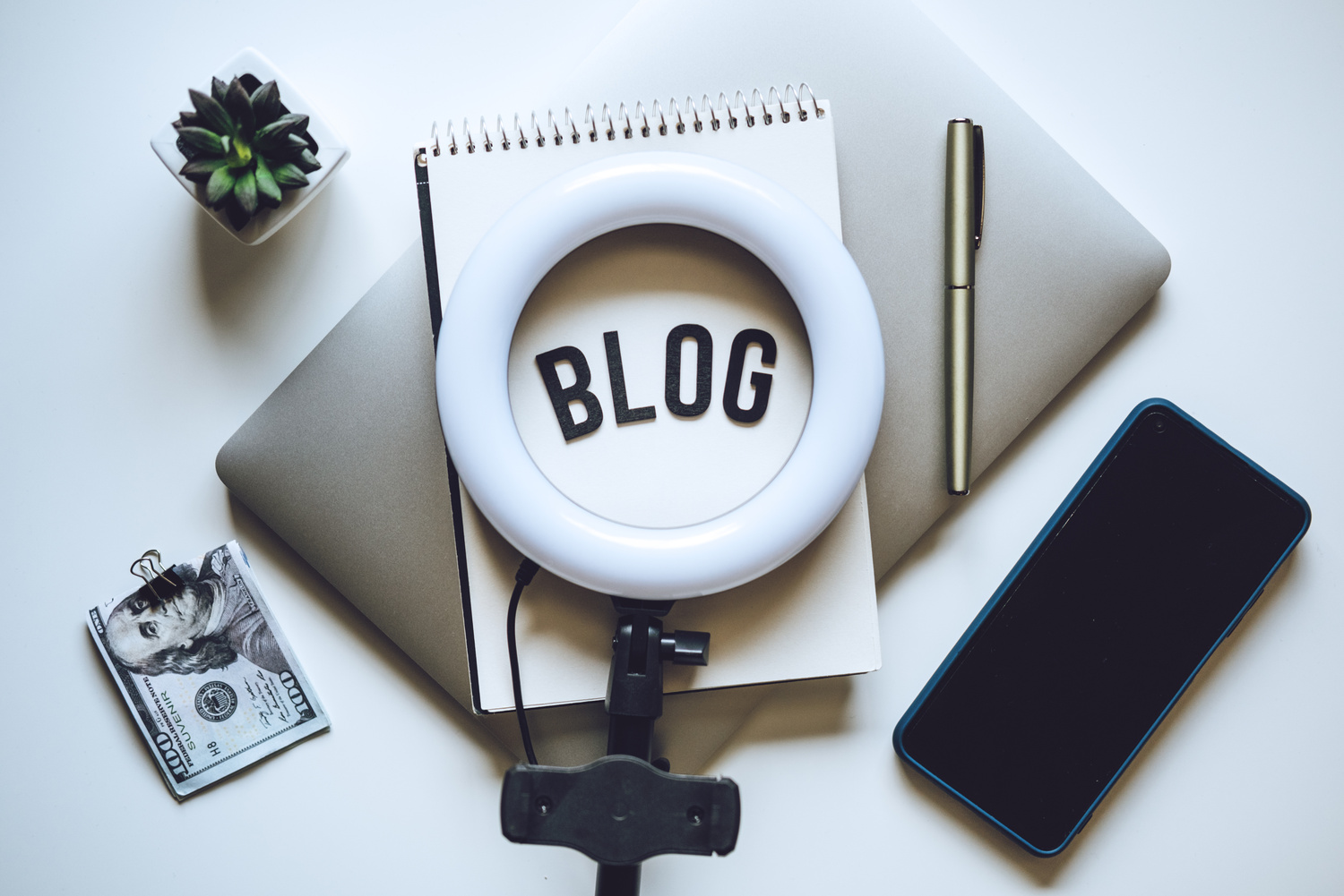 Blogging Equipment. How To Start Blog, Blogging for Beginners. Laptop, Mobile Phone, Ring Light, notebook and glasses on the table